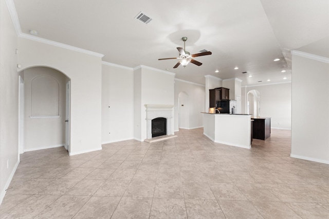 2043 Plum Rose Ln, Richmond, TX 77469 - unfurnished living room with arched walkways, a ceiling fan, crown molding, recessed lighting, and baseboards