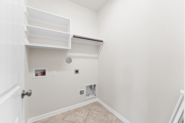 2043 Plum Rose Ln, Richmond, TX 77469 - laundry room featuring hookup for an electric dryer, gas dryer hookup, washer hookup, light tile patterned floors, and baseboards