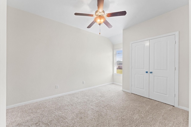 2043 Plum Rose Ln, Richmond, TX 77469 - unfurnished bedroom featuring carpet floors, a closet, baseboards, a ceiling fan, and lofted ceiling