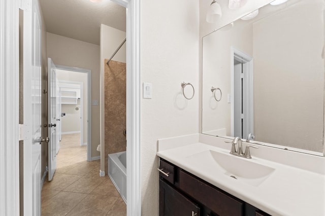 2043 Plum Rose Ln, Richmond, TX 77469 - bathroom with tile patterned flooring, vanity, bathtub / shower combination, and baseboards