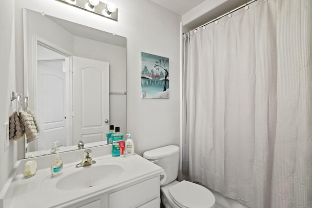 full bathroom featuring toilet, vanity, and curtained shower