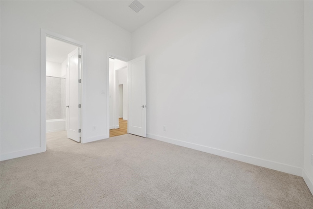unfurnished bedroom featuring carpet floors and baseboards