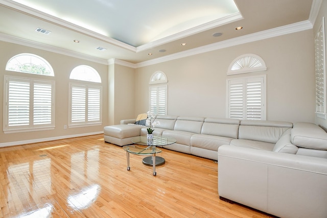 718 Roy St, Houston, TX 77007 - living room featuring light wood-type flooring, visible vents, a raised ceiling, and recessed lighting