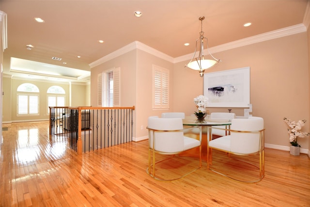 718 Roy St, Houston, TX 77007 - dining room with light wood-style floors, ornamental molding, baseboards, recessed lighting, and a tray ceiling