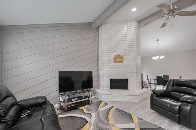 19942 Mountain Dale Dr, Cypress, TX 77433 - living area featuring a fireplace, a ceiling fan, a chandelier, wooden walls, and recessed lighting