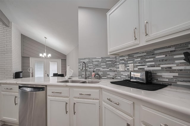 19942 Mountain Dale Dr, Cypress, TX 77433 - kitchen featuring dishwasher, decorative backsplash, vaulted ceiling, a sink, and white cabinetry