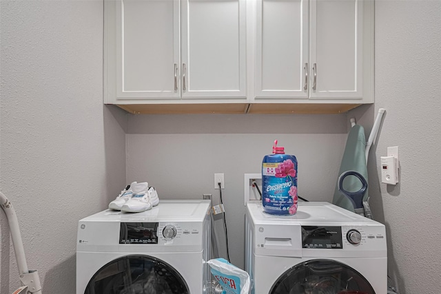 19942 Mountain Dale Dr, Cypress, TX 77433 - laundry area featuring separate washer and dryer, cabinet space, and a textured wall