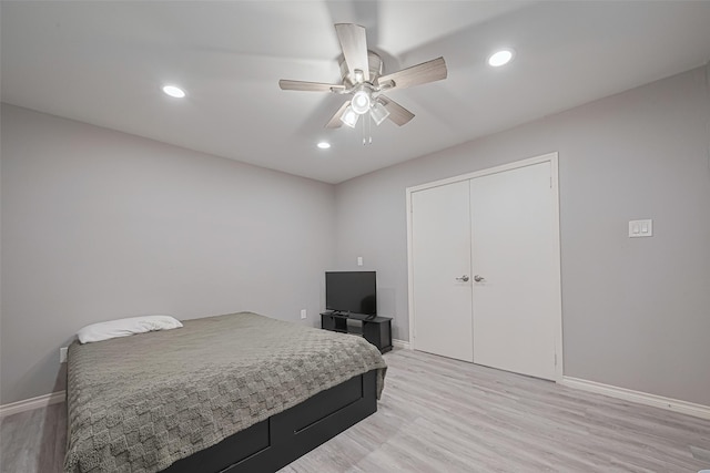 19942 Mountain Dale Dr, Cypress, TX 77433 - bedroom featuring baseboards, light wood-style floors, recessed lighting, ceiling fan, and a closet
