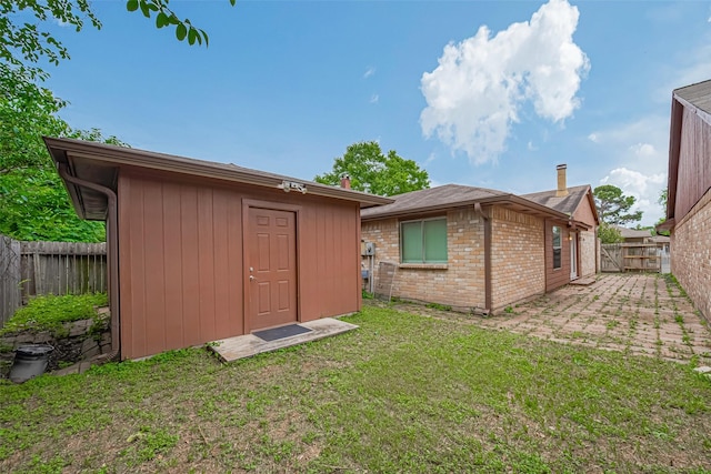 19942 Mountain Dale Dr, Cypress, TX 77433 - rear view of property with an outbuilding and brick siding