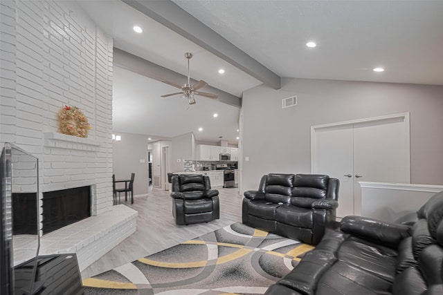 19942 Mountain Dale Dr, Cypress, TX 77433 - living area featuring ceiling fan, light wood-style floors, recessed lighting, a brick fireplace, and baseboards