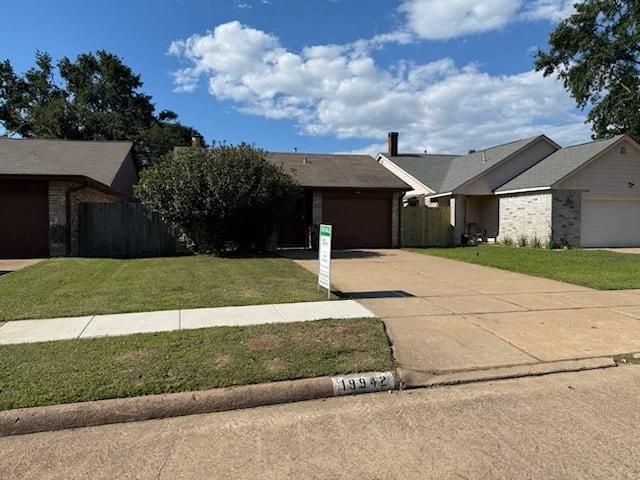 19942 Mountain Dale Dr, Cypress, TX 77433 - ranch-style home with driveway, a garage, and brick siding