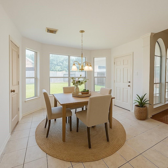 6334 Goodlowe Park, Sugar Land, TX 77479 - dining area featuring light tile patterned floors, a chandelier, and baseboards