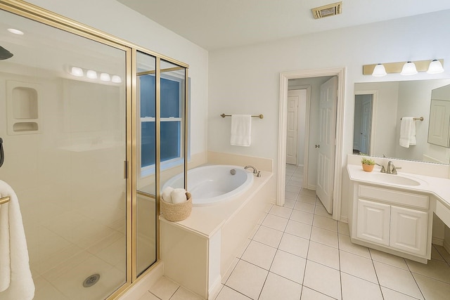 6334 Goodlowe Park, Sugar Land, TX 77479 - full bathroom featuring tile patterned floors, a shower stall, a bath, and vanity
