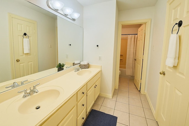6334 Goodlowe Park, Sugar Land, TX 77479 - bathroom featuring tile patterned floors, double vanity, toilet, and baseboards