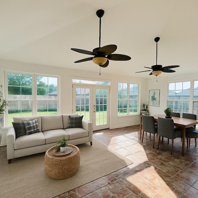 6334 Goodlowe Park, Sugar Land, TX 77479 - living area with a ceiling fan, healthy amount of natural light, french doors, stone finish flooring, and high vaulted ceiling