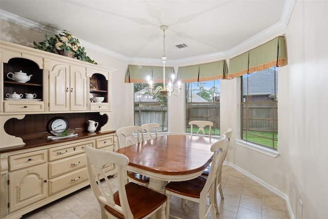 12909 Victoria Regina Dr, Montgomery, TX 77356 - dining area with a chandelier, light tile patterned flooring, crown molding, and baseboards