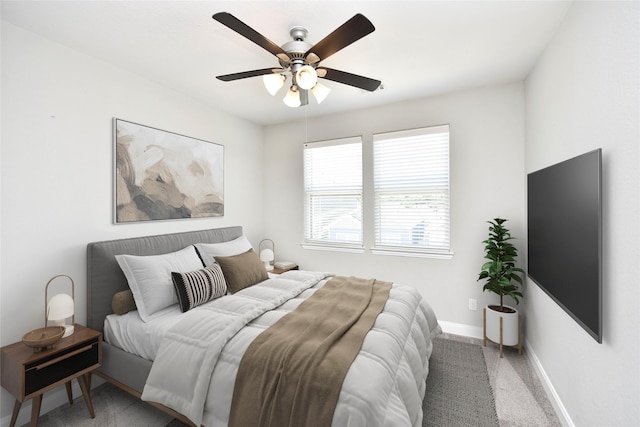 5502 Camaguey St, Houston, TX 77023 - bedroom with baseboards, a ceiling fan, and light carpet