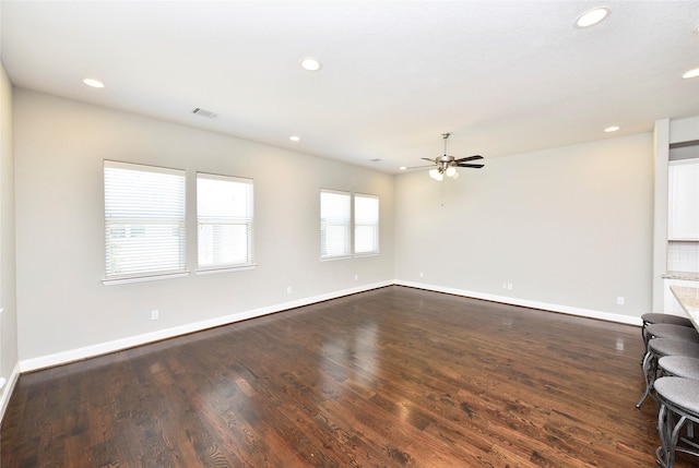 5502 Camaguey St, Houston, TX 77023 - unfurnished living room with baseboards, recessed lighting, a ceiling fan, and dark wood finished floors