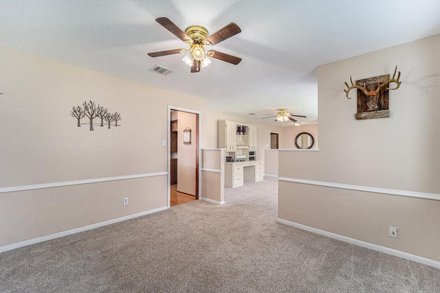 1618 Monroe Dr, Deer Park, TX 77536 - empty room featuring ceiling fan, light colored carpet, and baseboards