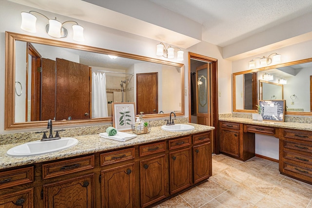 1618 Monroe Dr, Deer Park, TX 77536 - bathroom featuring double vanity, curtained shower, and a textured ceiling