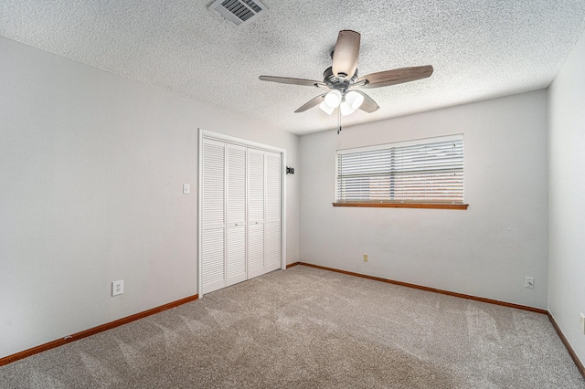 1618 Monroe Dr, Deer Park, TX 77536 - unfurnished bedroom with a closet, carpet flooring, a textured ceiling, baseboards, and ceiling fan