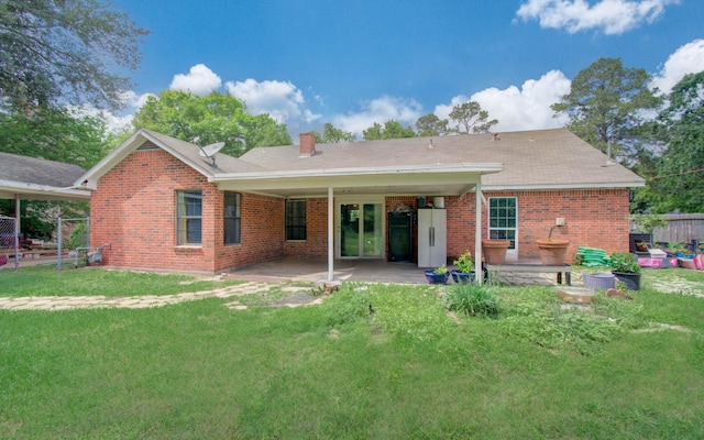 2915 Quailwood St, Houston, TX 77014 - back of house featuring a patio area, brick siding, and a chimney