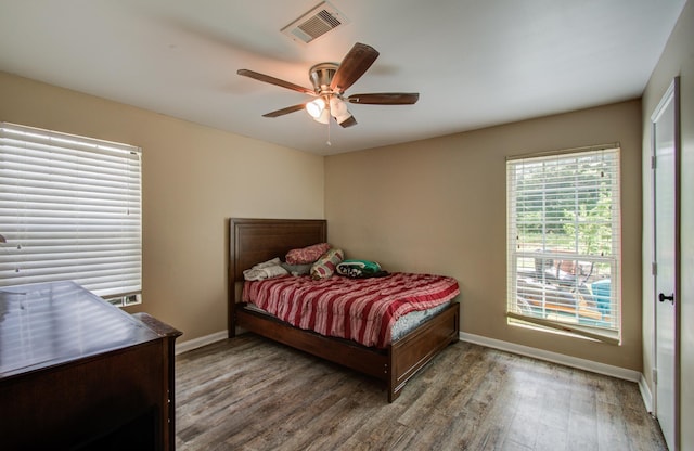 2915 Quailwood St, Houston, TX 77014 - bedroom with baseboards, wood finished floors, and a ceiling fan
