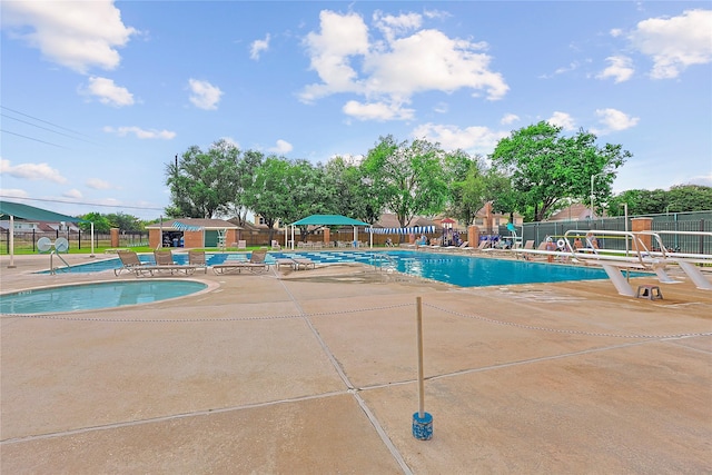 12915 Birch Falls Rd, Houston, TX 77065 - community pool featuring fence, a patio, and an outbuilding