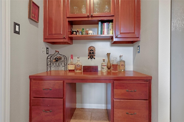12915 Birch Falls Rd, Houston, TX 77065 - bar with built in study area and light tile patterned flooring