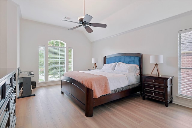 12915 Birch Falls Rd, Houston, TX 77065 - bedroom featuring vaulted ceiling, light wood-style flooring, and a ceiling fan