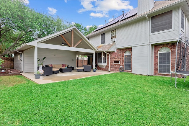 12915 Birch Falls Rd, Houston, TX 77065 - back of house featuring an outdoor hangout area, a trampoline, ceiling fan, a patio area, and a chimney