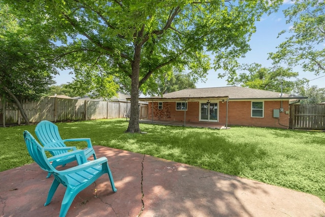rear view of property with a patio area and brick siding