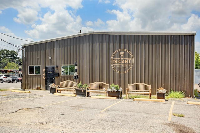 view of property featuring uncovered parking