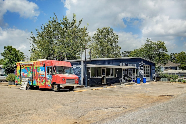 view of commercial property with uncovered parking