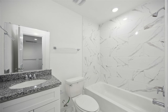 bathroom featuring vanity, toilet, washtub / shower combination, and recessed lighting