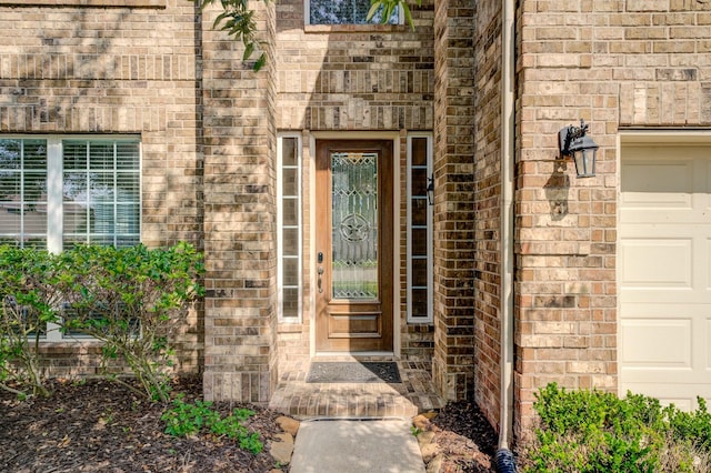 8246 Mandalay Bay Dr, Baytown, TX 77523 - doorway to property featuring brick siding