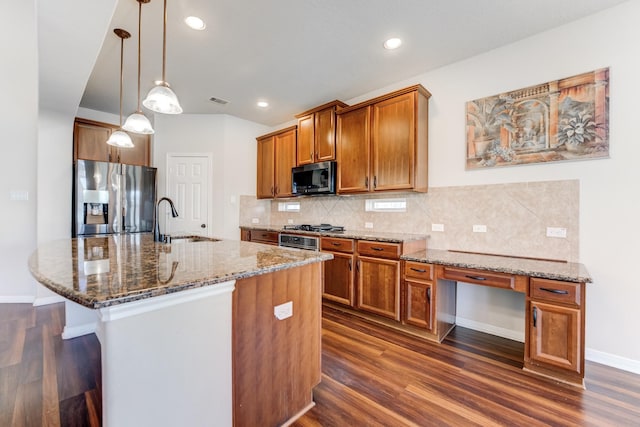 8246 Mandalay Bay Dr, Baytown, TX 77523 - kitchen with stainless steel appliances, a sink, dark wood-style flooring, brown cabinetry, and recessed lighting