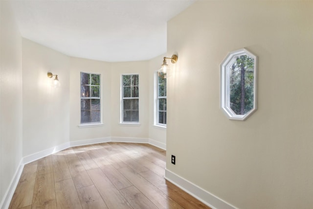 28 Stony Creek Dr, Conroe, TX 77384 - spare room with wood finished floors, plenty of natural light, and baseboards