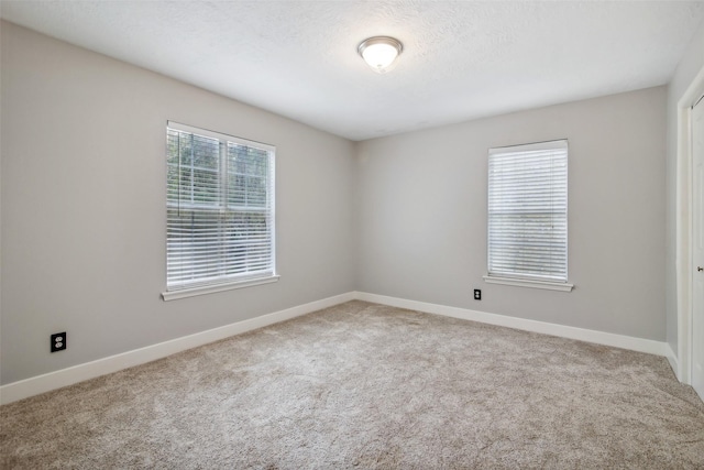 28 Stony Creek Dr, Conroe, TX 77384 - carpeted empty room featuring baseboards