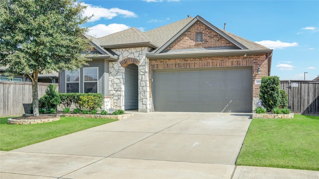 2815 Torrey Pines Dr, Fulshear, TX 77423 - french country inspired facade featuring a garage, stone siding, driveway, roof with shingles, and brick siding