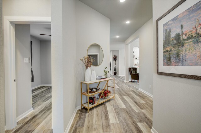 2815 Torrey Pines Dr, Fulshear, TX 77423 - hallway with light wood-type flooring, recessed lighting, and baseboards