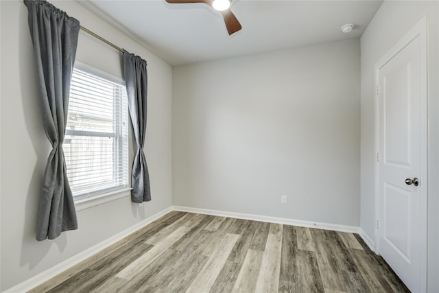 2815 Torrey Pines Dr, Fulshear, TX 77423 - empty room with wood finished floors, ceiling fan, baseboards, and a smoke detector