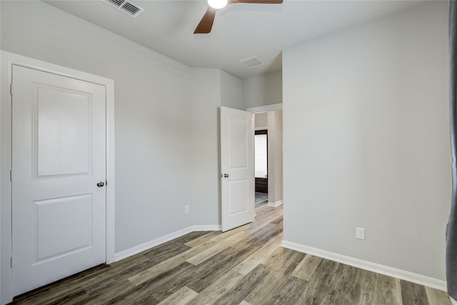 2815 Torrey Pines Dr, Fulshear, TX 77423 - unfurnished bedroom featuring wood finished floors, baseboards, and a ceiling fan