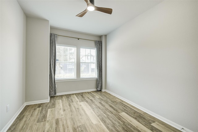 2815 Torrey Pines Dr, Fulshear, TX 77423 - empty room featuring wood finished floors, ceiling fan, and baseboards