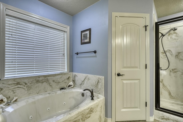 full bath featuring a textured ceiling, a marble finish shower, and a tub with jets