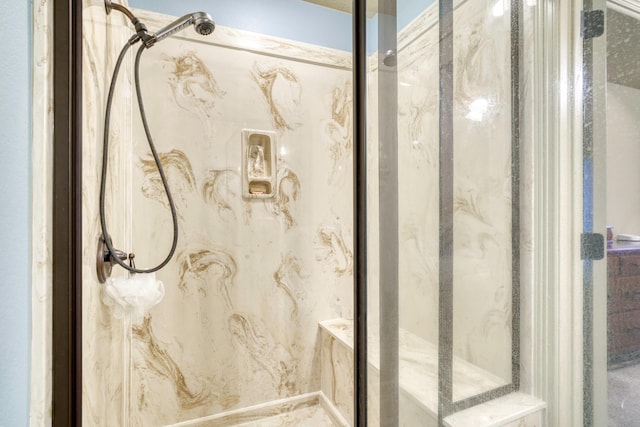 full bath featuring a marble finish shower
