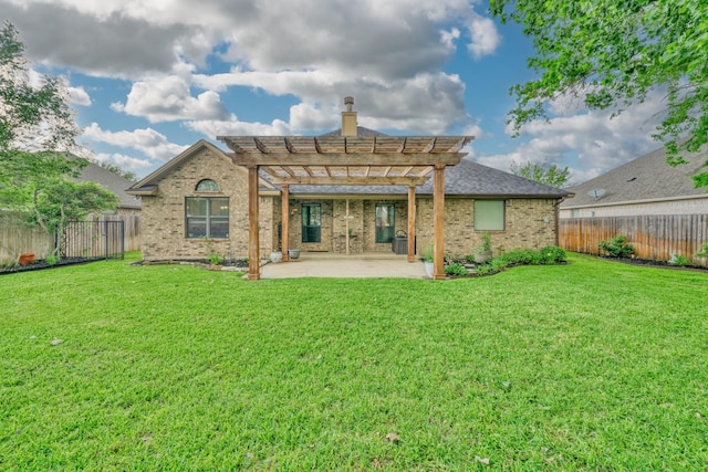 rear view of property with a pergola, brick siding, and a patio area