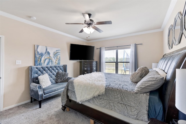 carpeted bedroom featuring crown molding, baseboards, and ceiling fan
