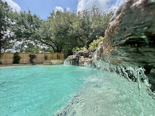 view of pool with fence