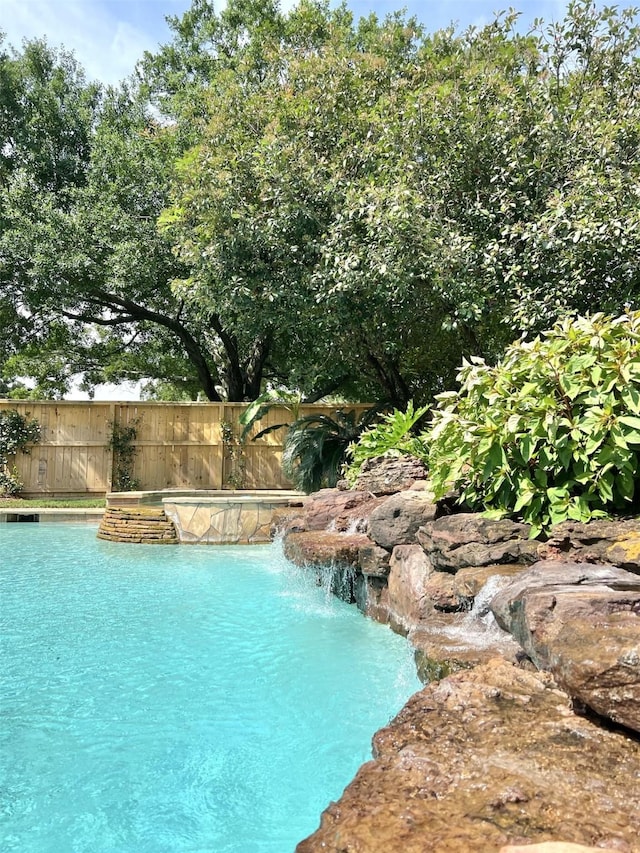 view of pool with fence